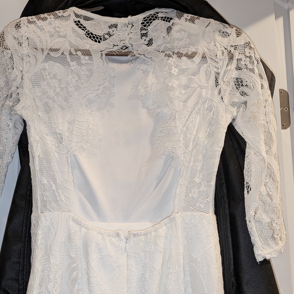 White Lace Long-Sleeve Wedding Dress with Sheer Back Detail